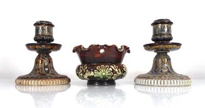 Lot 310 - A pair of Doulton Lambeth dwarf candlesticks...