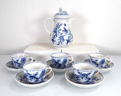 Lot 311 - A blue and white onion pattern teapot and...