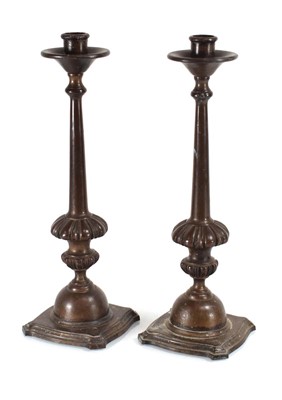 Lot 138 - A pair of early 20th century brown patinated...