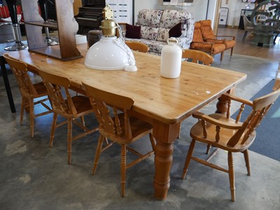 Lot 1025 - Large pine farmhouse table with 7 matching...