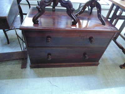 Lot 87 - A stained pine chest of two long drawers