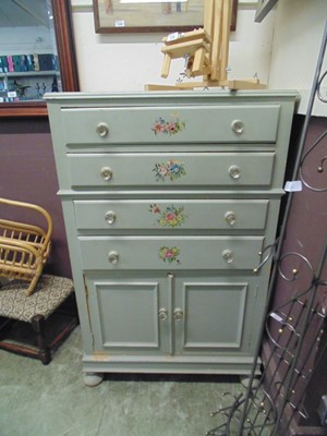 Lot 57 - A pale green chest having four drawers above...