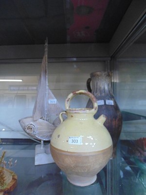 Lot 303 - A yellow and brown terracotta teapot along...