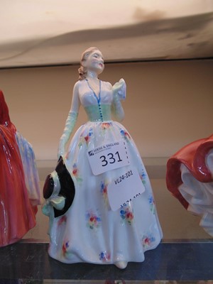 Lot 331 - A Royal Doulton ceramic figurine 'Caroline'...