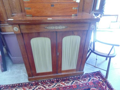 Lot 25 - A 19th century mahogany cabinet having a pair...