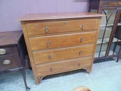 Lot 42 - An early 20th century walnut chest of four...