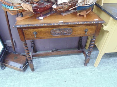 Lot 50 - An early 20th century oak side table with...