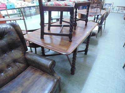 Lot 69 - An early 20th century oak drawer leaf table on...