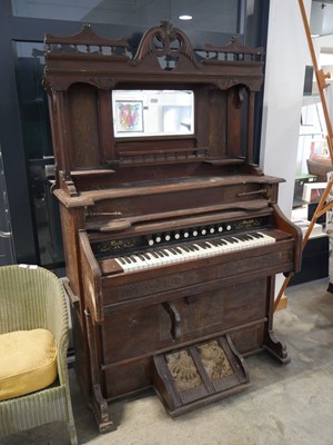 Lot 1034 - Large church style organ with ornate decorations.