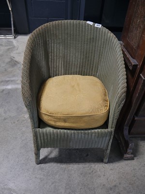 Lot 1035 - Lloyd Loom chair with cushion in a khaki colour