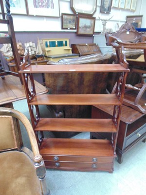 Lot 81 - An early 20th century mahogany shelving unit...