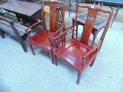 Lot 93 - A pair of Chinese hardwood open armchairs