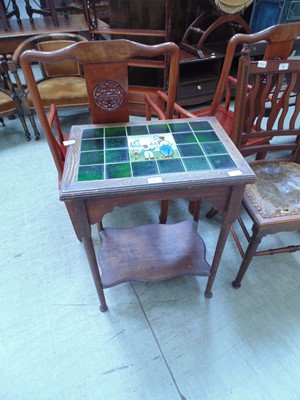 Lot 95 - An early 20th century oak two tier table with...