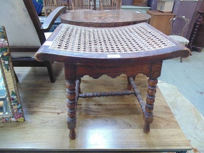 Lot 101 - An early 20th century bergere seated oak stool