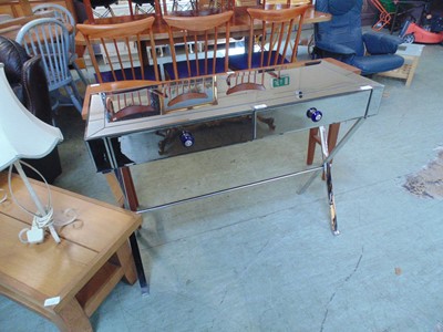 Lot 105 - A mirrored two drawer dressing table