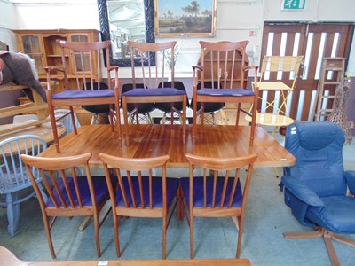 Lot 107 - A mid-20th century teak extending dining table...