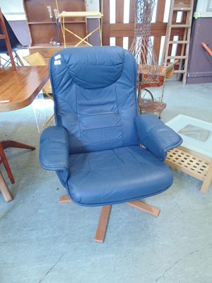 Lot 108 - A blue upholstered swivel easy chair