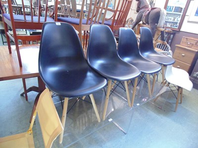 Lot 113 - A set of four black Eames style chairs