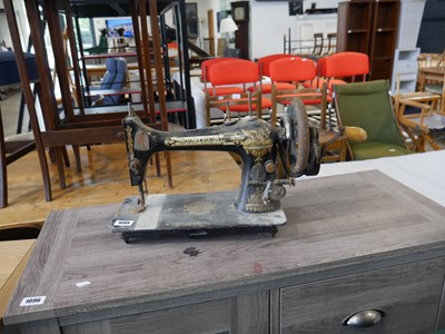 Lot 1099 - Singer sewing machine with handle