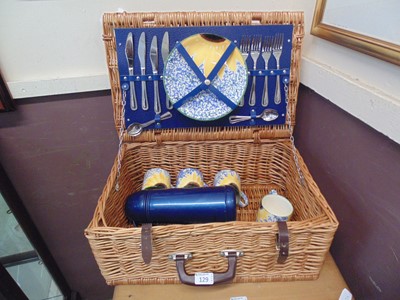 Lot 129 - A wicker picnic basket containing Poole...