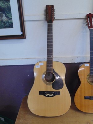 Lot 146 - A twelve string acoustic guitar by Melody...