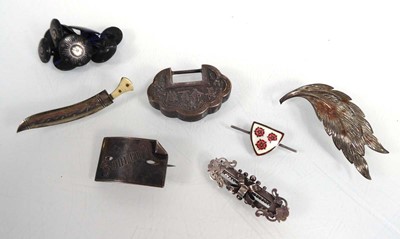 Lot 437 - Five silver and metalware brooches including...