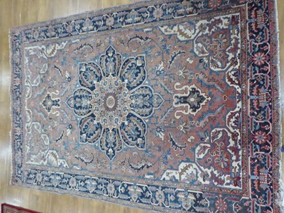 Lot 17 - An Iranian wool carpet, the central navy...