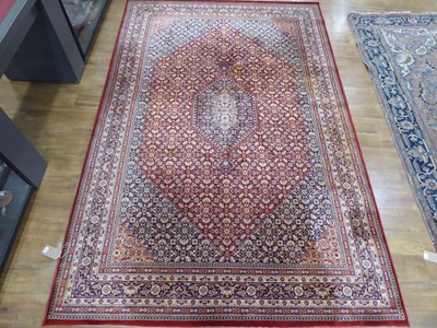 Lot 18 - A Belgian Ambassador wool carpet with...