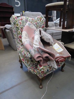 Lot 5317 - Floral patterened wing back armchair