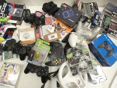 Lot 2421 - Quantity of gaming accessories; controllers,...