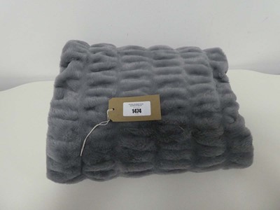 Lot 1474 - A grey faux fur throw.