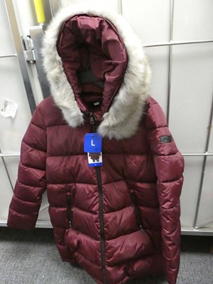 Lot 1492 - A ladies DKNY coat with fur hood in red wine....