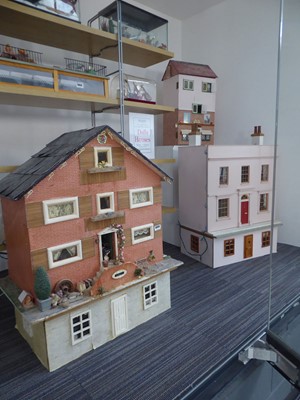 Lot 5055 - Three doll's houses with some furniture and...