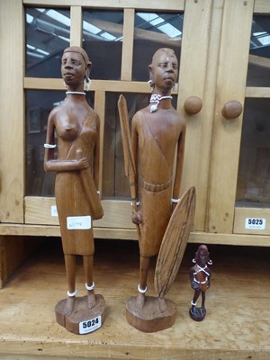 Lot 5024 - 3 carved East African figures plus a print of...