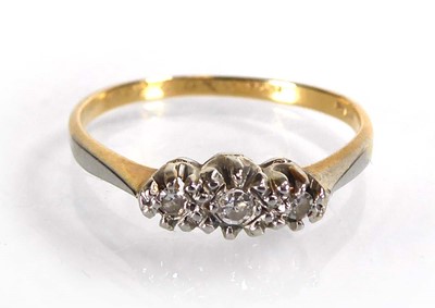 Lot An 18ct yellow gold ring set three small...