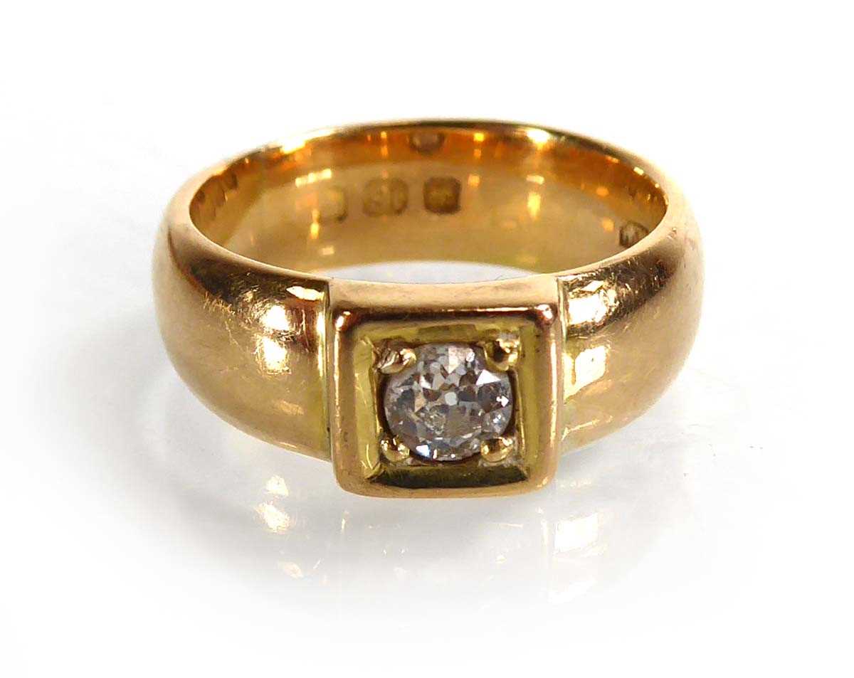 Lot An 18ct yellow gold ring set brilliant cut...