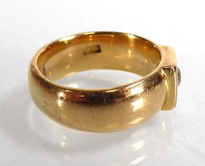 Lot An 18ct yellow gold ring set brilliant cut...