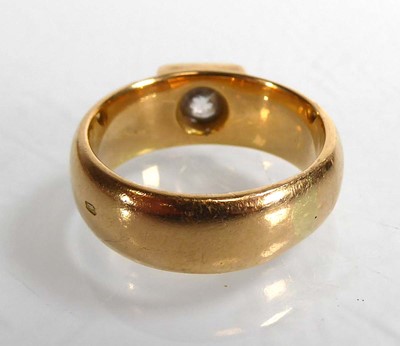 Lot An 18ct yellow gold ring set brilliant cut...