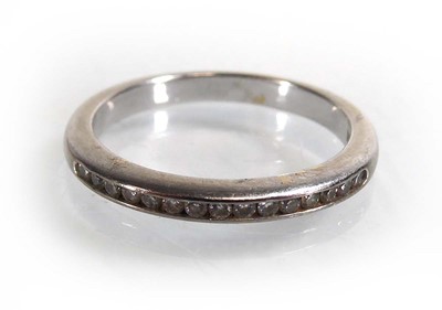 Lot An 18ct white gold half eternity ring set...