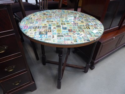 Lot 5180 - Table with folding base and postage stamp...