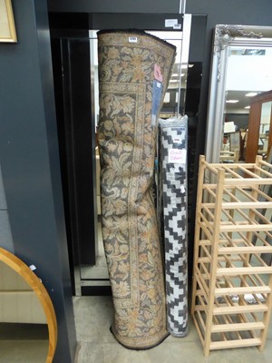 Lot 5263 - Floral patterned carpet with black border