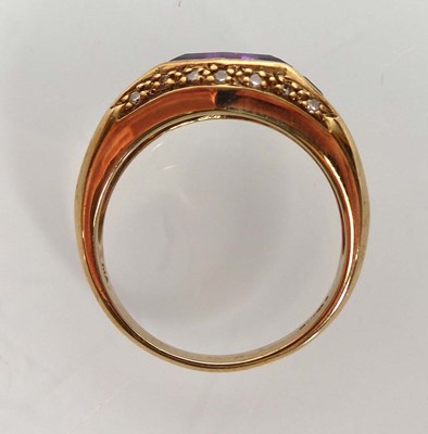 Lot 804 - A 9ct yellow gold ring set diamond shaped...