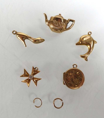 Lot Five 9ct yellow gold and yellow metal charms...