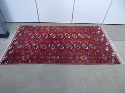 Lot 5358 - Turkeman mat with red background