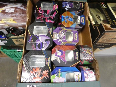 Lot 2459 - Box containing various empty Pokémon tins