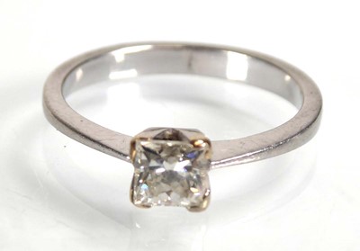 Lot 802 - A white metal ring set princess cut diamond in...