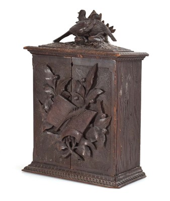 Lot 71 - A Black Forest style collectors cabinet, the...