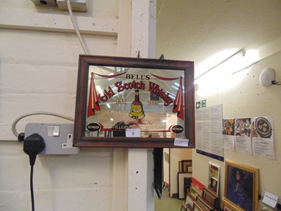 Lot 9 - A small framed pub mirror advertising Bells...