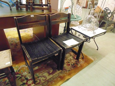 Lot 36 - A pair of slatted chairs in the style of...