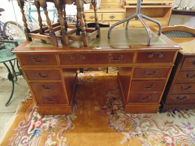 Lot 41 - A reproduction yew twin pedestal desk with...